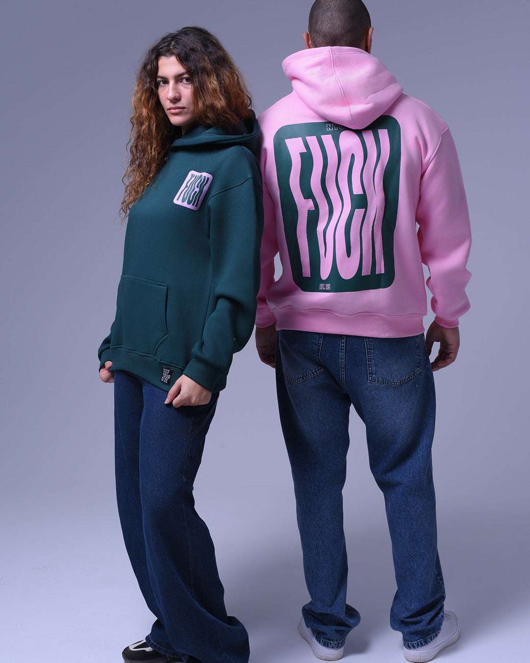 NotYourSize2025 oversized hoodie for unisex in green and pink with bold graphic design worn by models