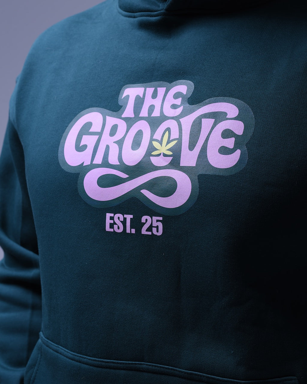NotYourSize2025 oversized hoodie for women in dark color with The Groove graphic and EST 25 text