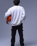 Back view of man wearing white oversized crewneck sweatshirt holding basketball by NotYourSize2025