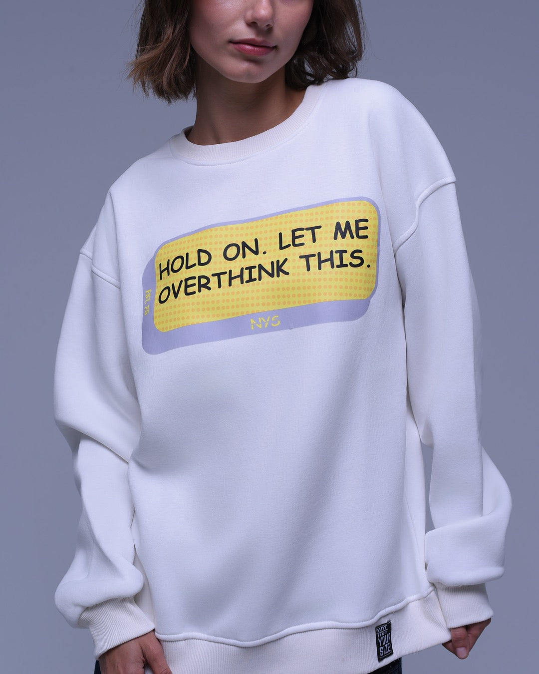White oversized crewneck sweatshirt with Hold On Let Me Overthink This print on front by NotYourSize2025