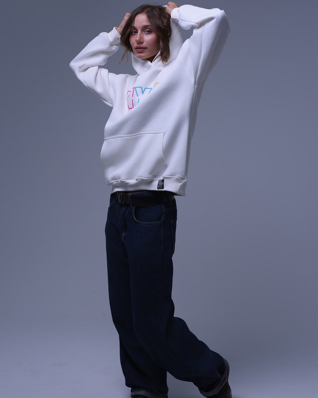 White oversized hoodie for unisex by nys with colorful logo and front pocket