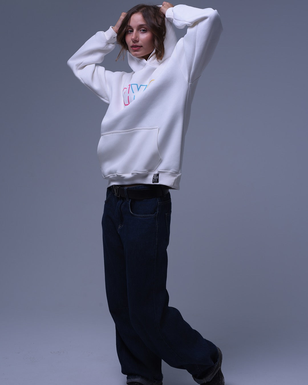 White oversized hoodie for unisex by nys with colorful logo and front pocket
